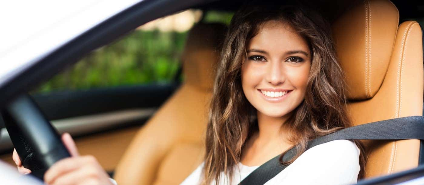 happy-woman-sitting-in-car