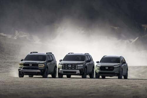 3 SUVs parked in a row