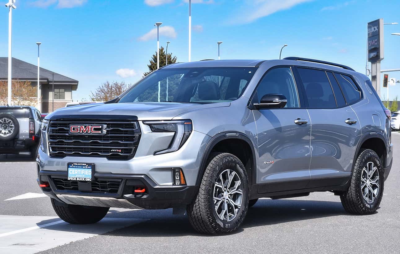 A GMC SUV parked in a lot