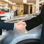 Finance employee and customer shaking hands