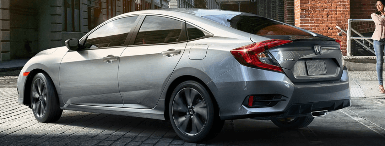 A 2020 Honda Civic Sedan driving on a city street