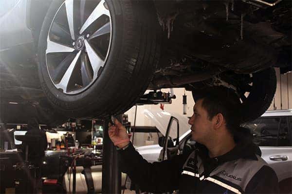 Checking tire tread on a Lexus