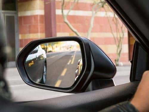 2024 Toyota Camry view of rear view mirror with blind spot monitor warning light on