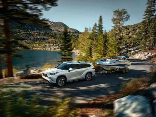 2024 Toyota Highlander towing a boat