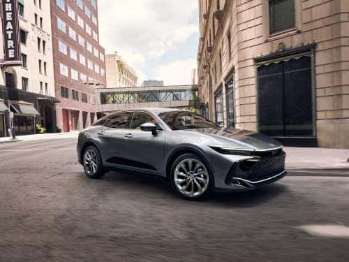 2024 Toyota Crown driving around a street corner