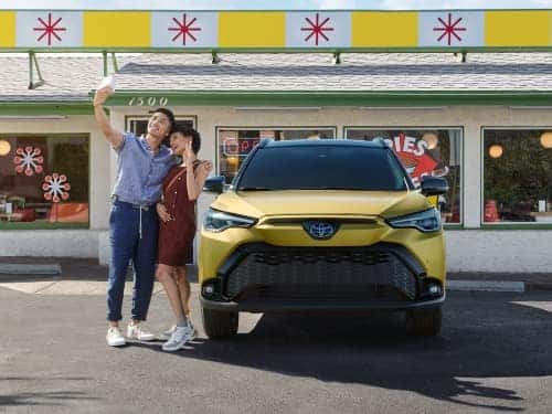 2024 Toyota Corolla Cross front exterior view parked outside a cafe