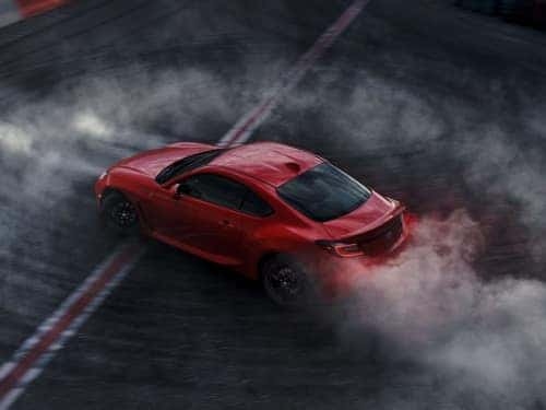 2024 Toyota GR86 overhead view of car doing donuts on a blacktop